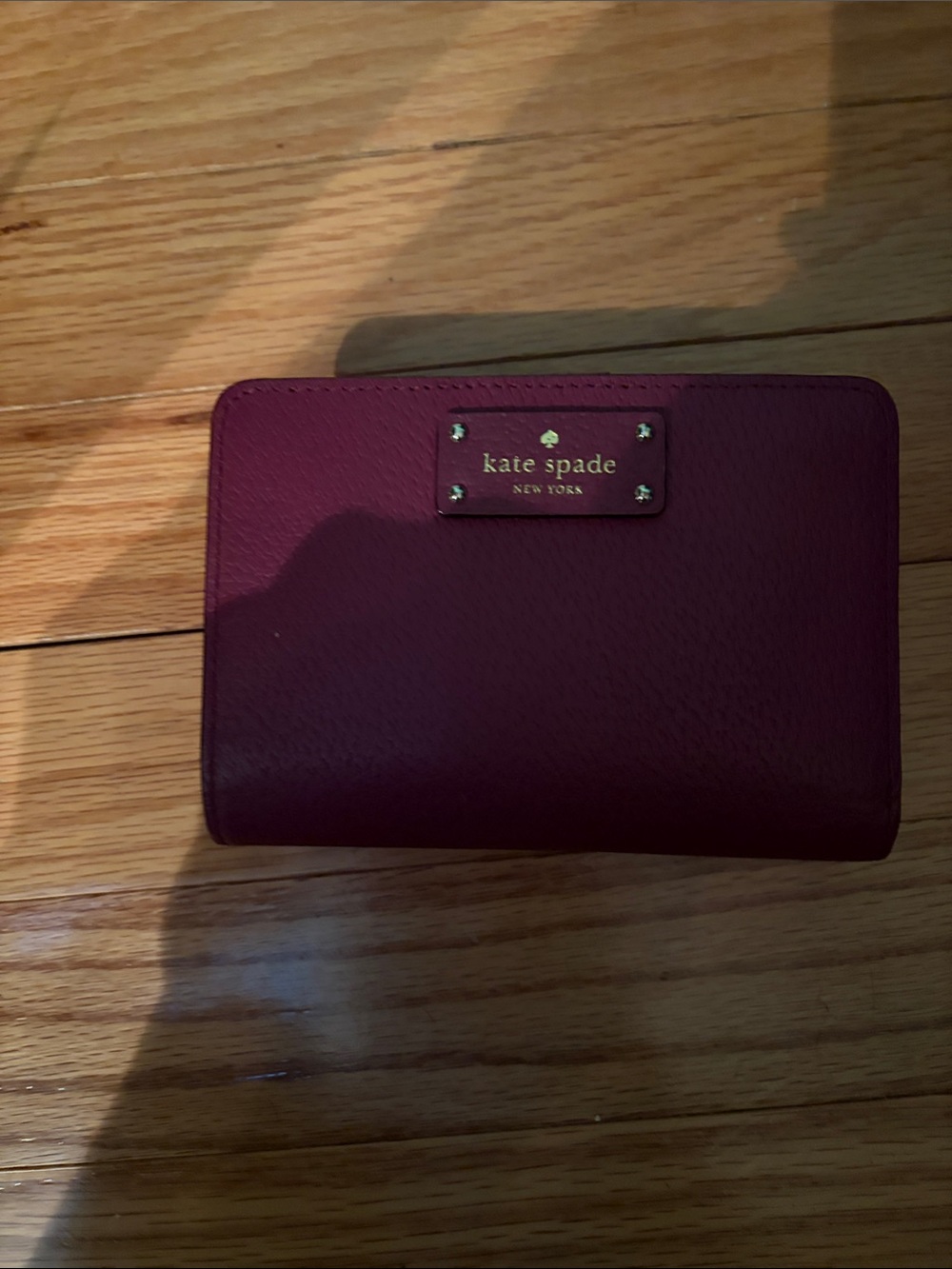 kate spade plum zip-around compact wallet with gold plaque